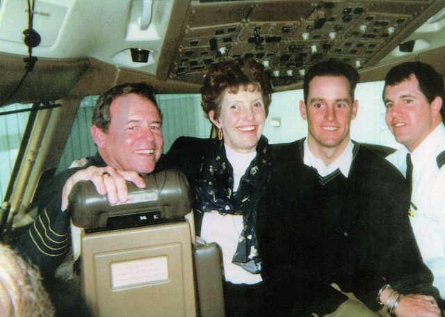 In the cockpit of a United 777 on John McFaddens last trip -- John, Kathy, sons Greg and John who was his co-pilot.